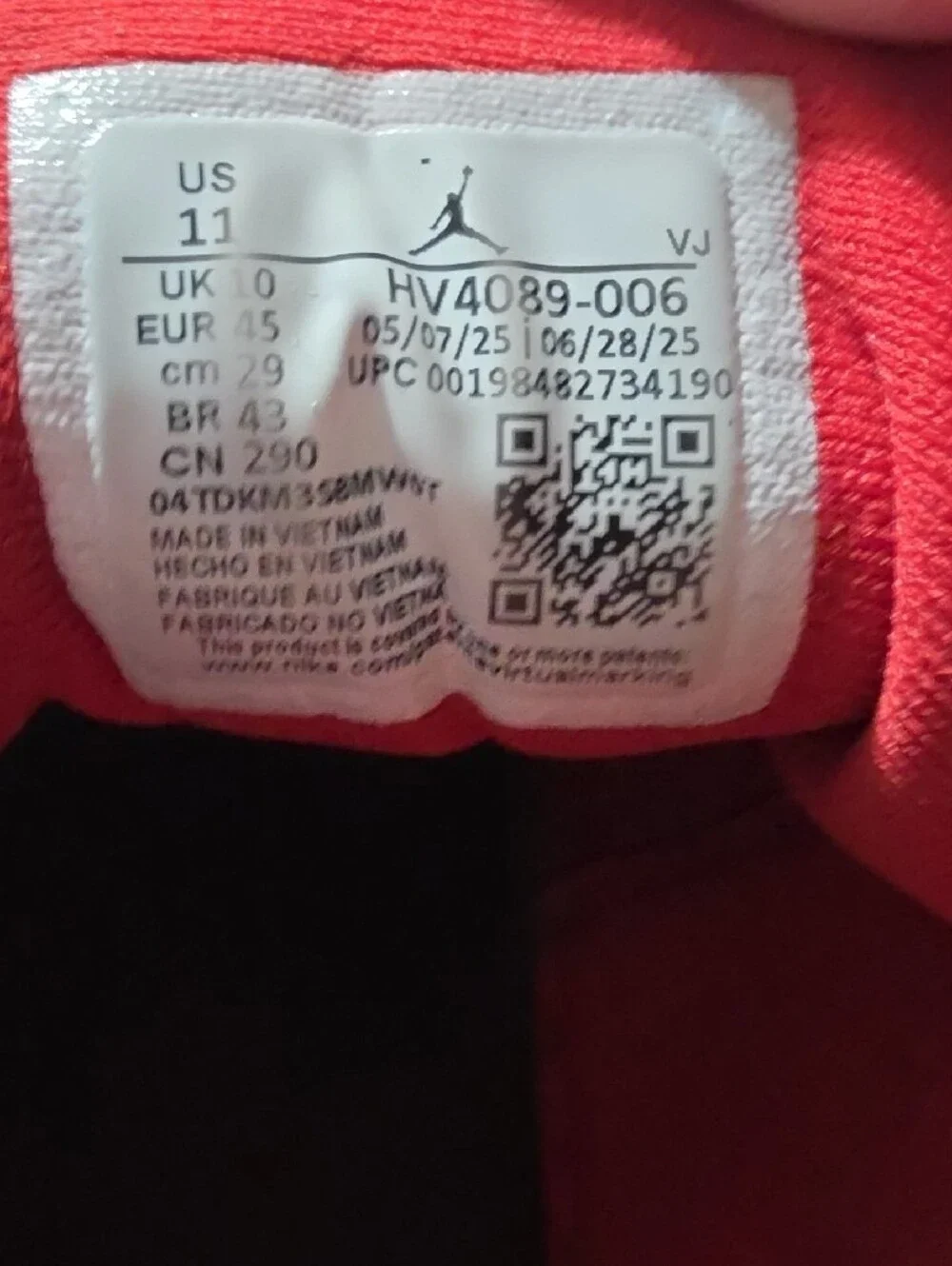 Jordan Red and Black High-Top Sneaker Tongue Label Detail